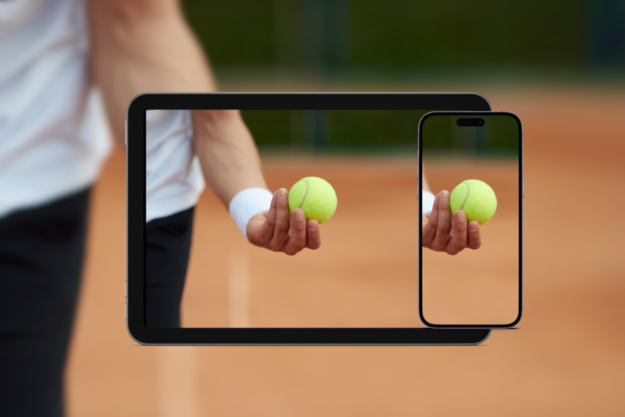 Tennis player holding ball with devices